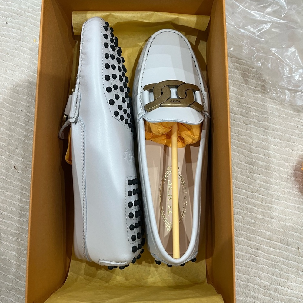 Tod's Elegant White Loafers with Gold Accent